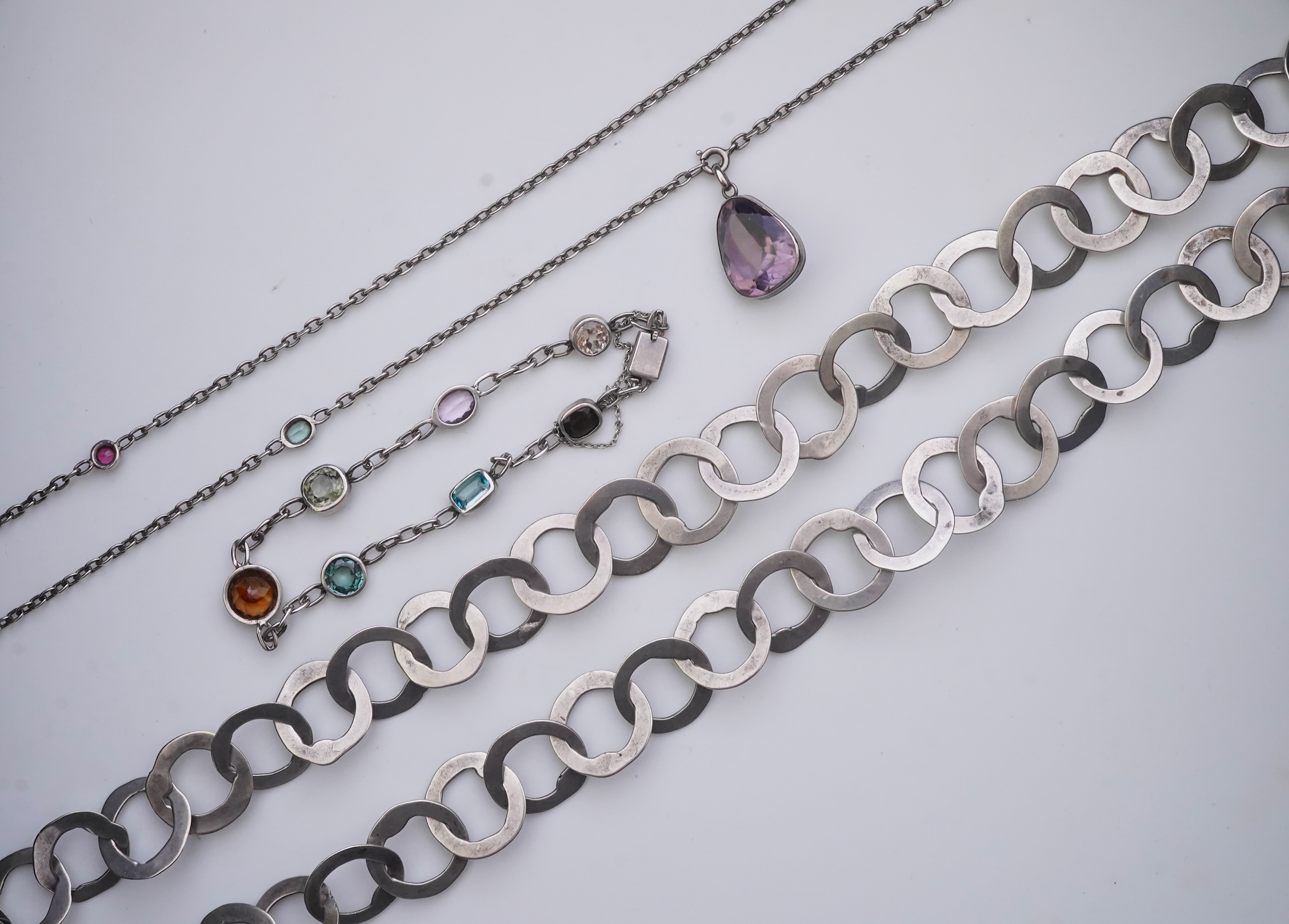 A collection of silver and gem-set jewellery